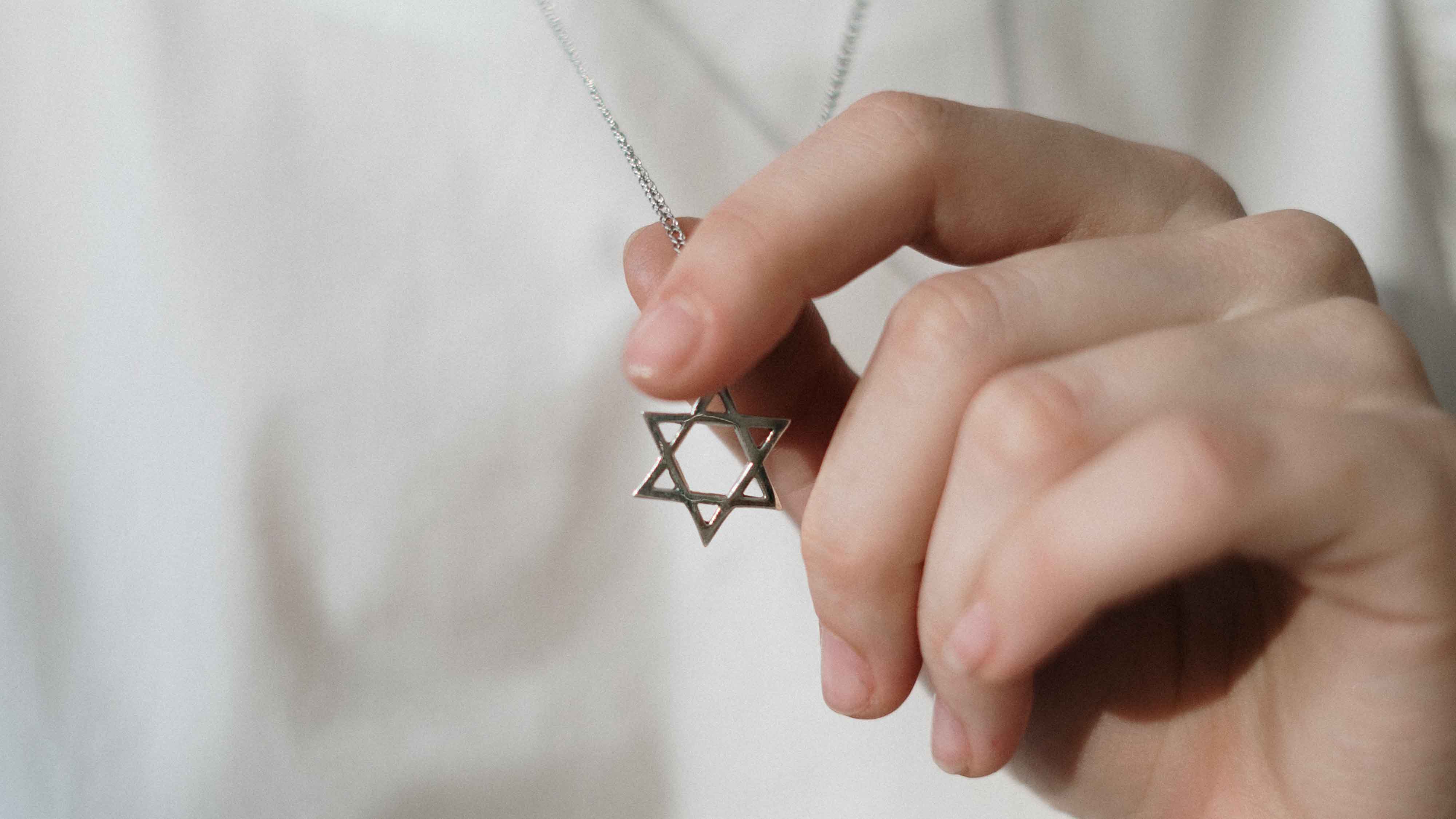 person-holding-a-star-of-david-4040841