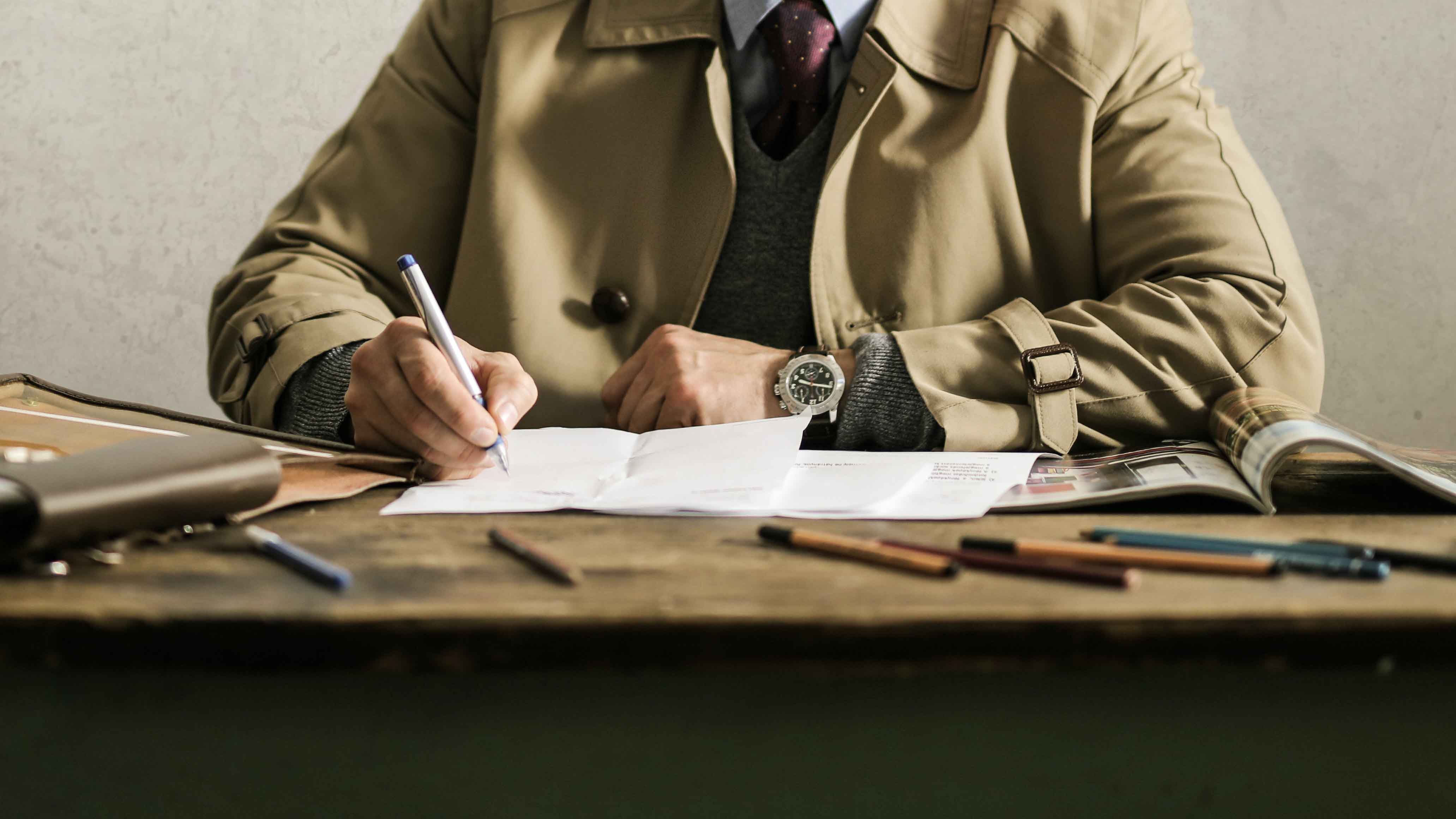 focused-male-architect-working-on-paper-draft-3771098
